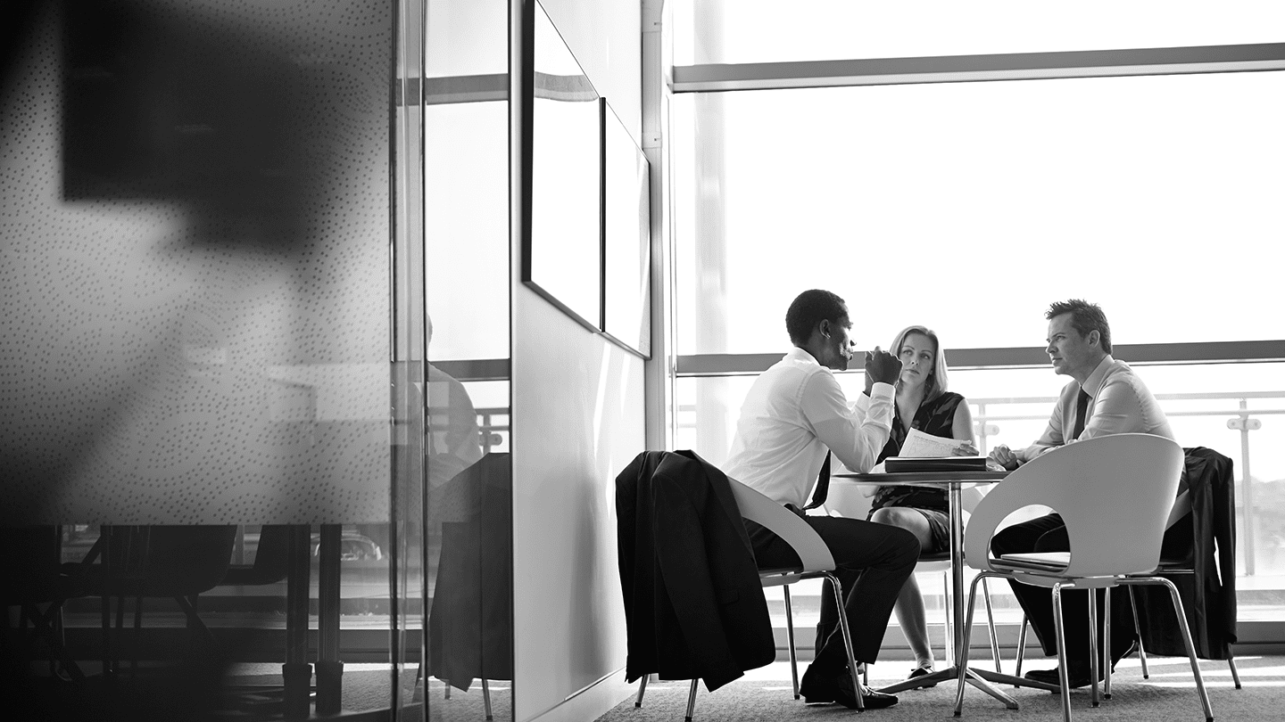 Discussion between two men and a woman